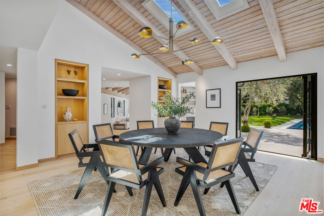 1508 Old Oak Road Los Angeles, CA 90049 - Photo 8 of 63 a view of a dining room with furniture window and wooden floor