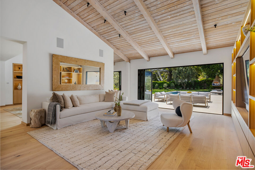 1508 Old Oak Road Los Angeles, CA 90049 - Photo 10 of 63 a living room with furniture and a large window
