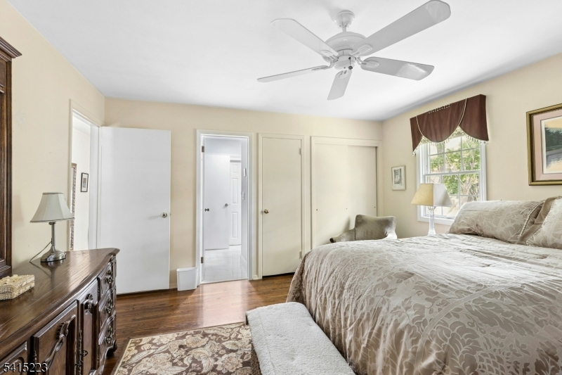 33 Carol Road Westfield, NJ 07090 - Photo 15 of 23 a bedroom with a bed and a chandelier