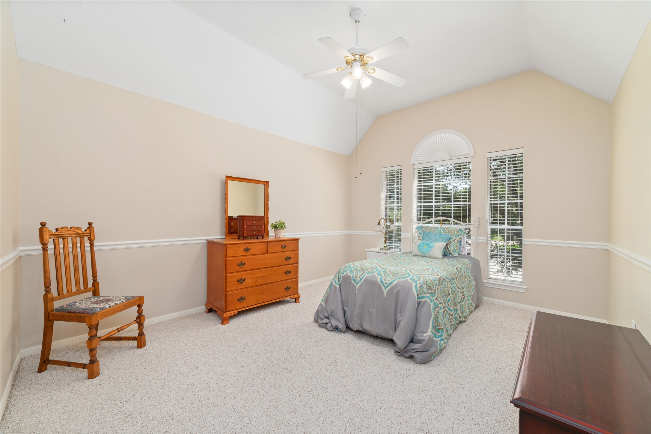 20423 Forest Drive Spring, TX 77388 - Photo 41 of 44 Spacious bedroom featuring a large layout, a ceiling fan for climate control, and direct access to a Jack and Jill bathroom.