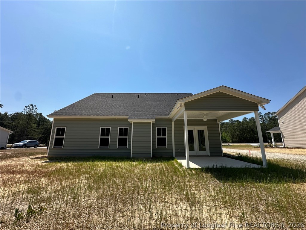 2908 Calloway Road Raeford, NC 28376 - Photo 24 of 25 a view of a house with a backyard