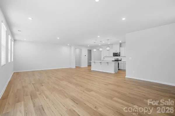 a view of kitchen with wooden floor