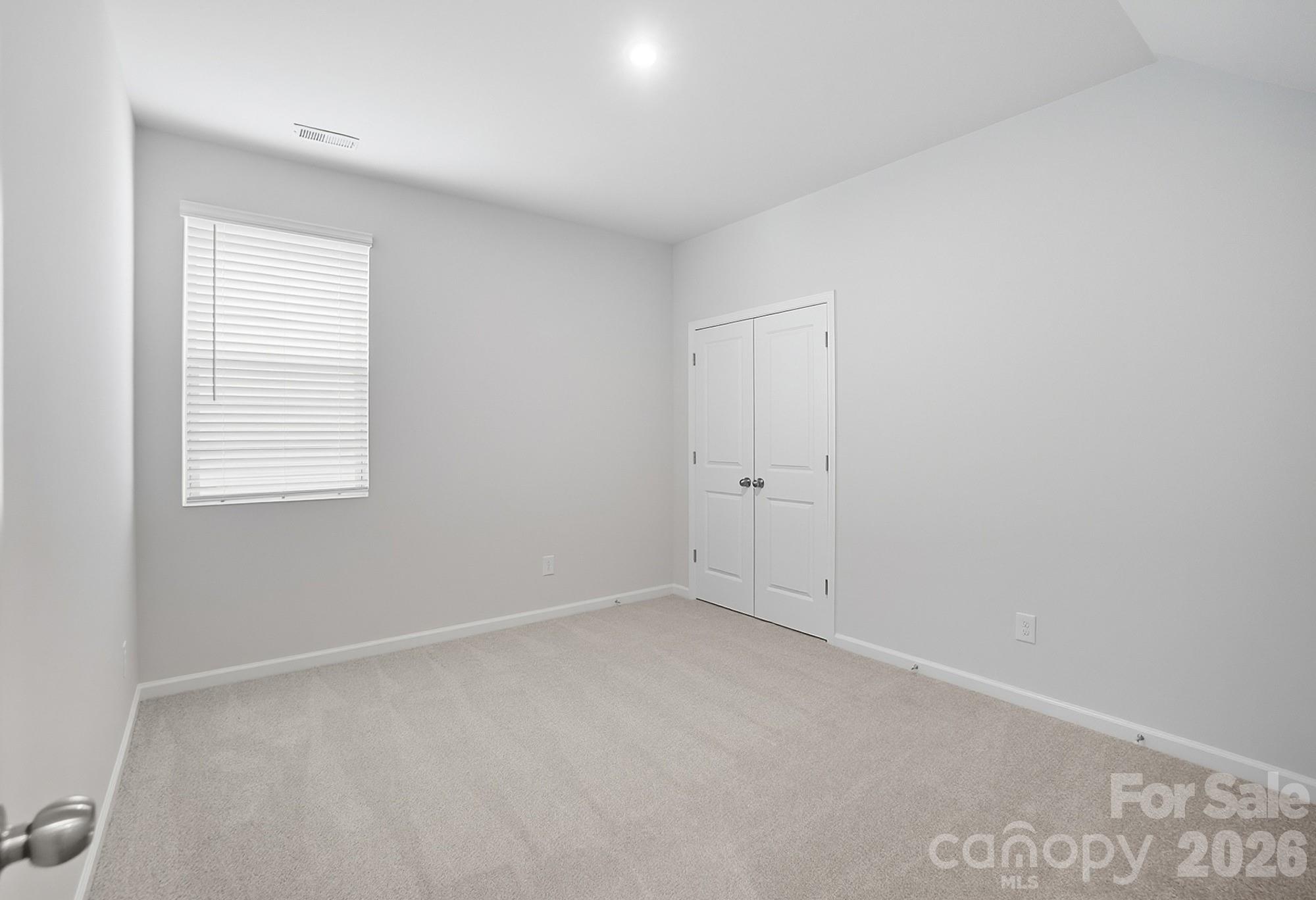1505 Miriam Way Monroe, NC 28112 - Photo 17 of 29 an empty room with a window