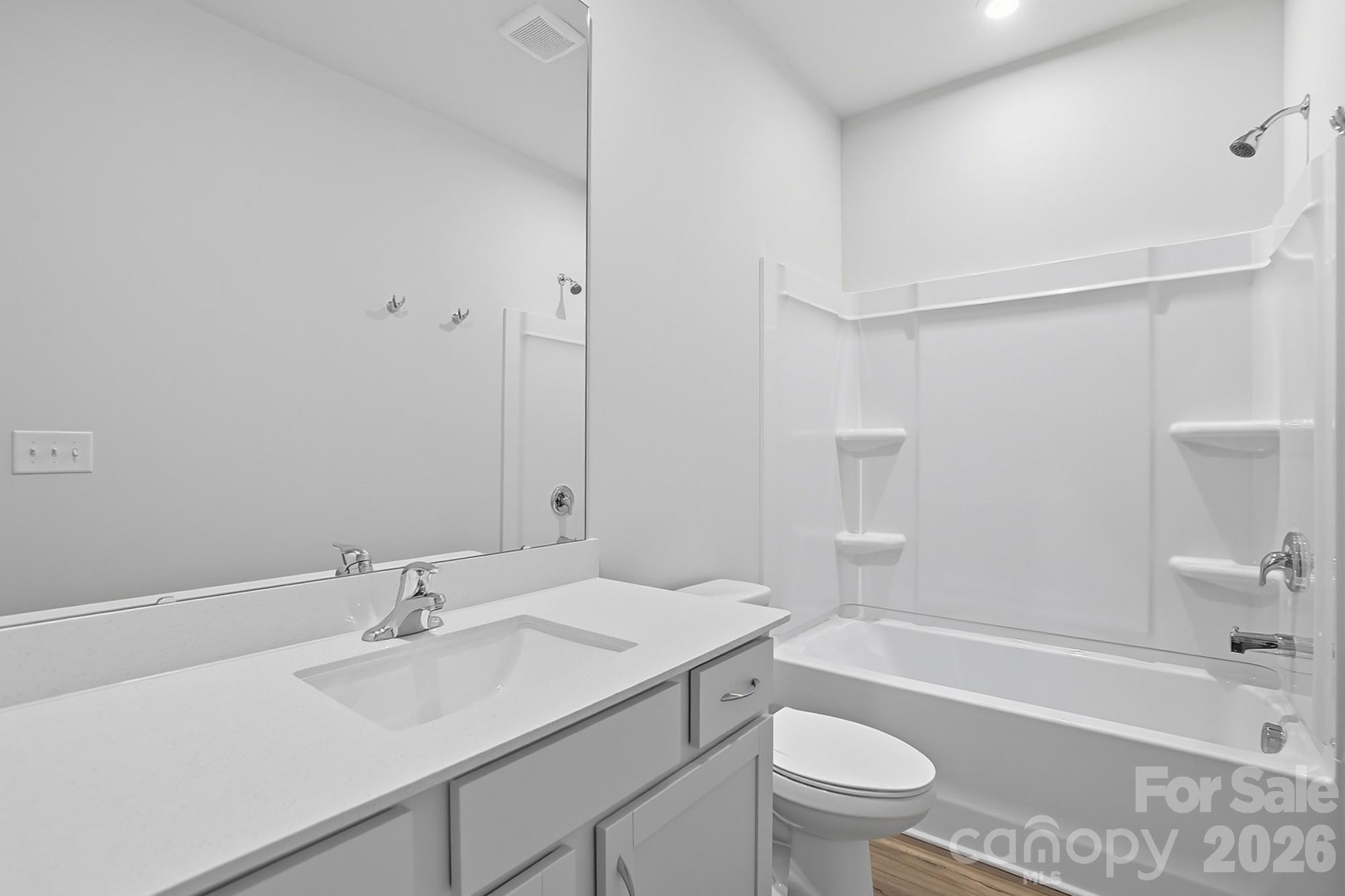 1505 Miriam Way Monroe, NC 28112 - Photo 19 of 29 a bathroom with a sink a toilet and shower