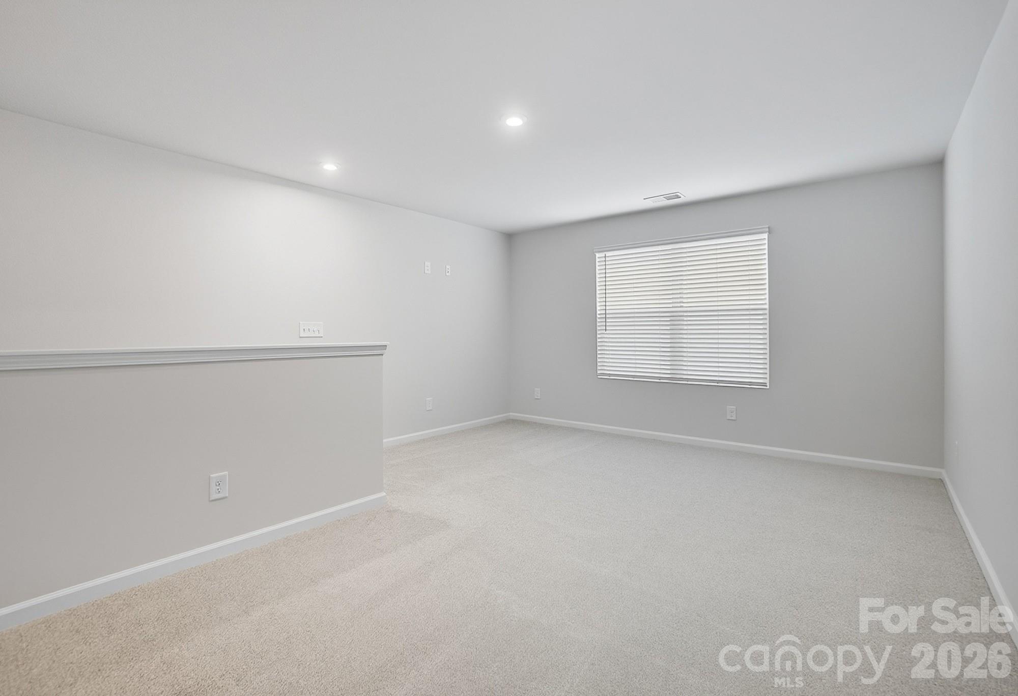 1505 Miriam Way Monroe, NC 28112 - Photo 21 of 29 an empty room with windows