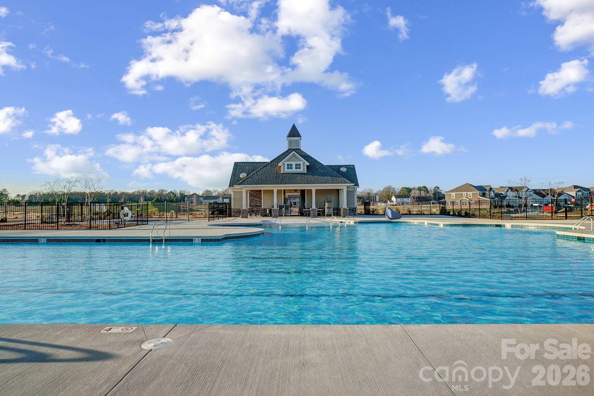 1505 Miriam Way Monroe, NC 28112 - Photo 26 of 29 a view of a lake with a house in the background