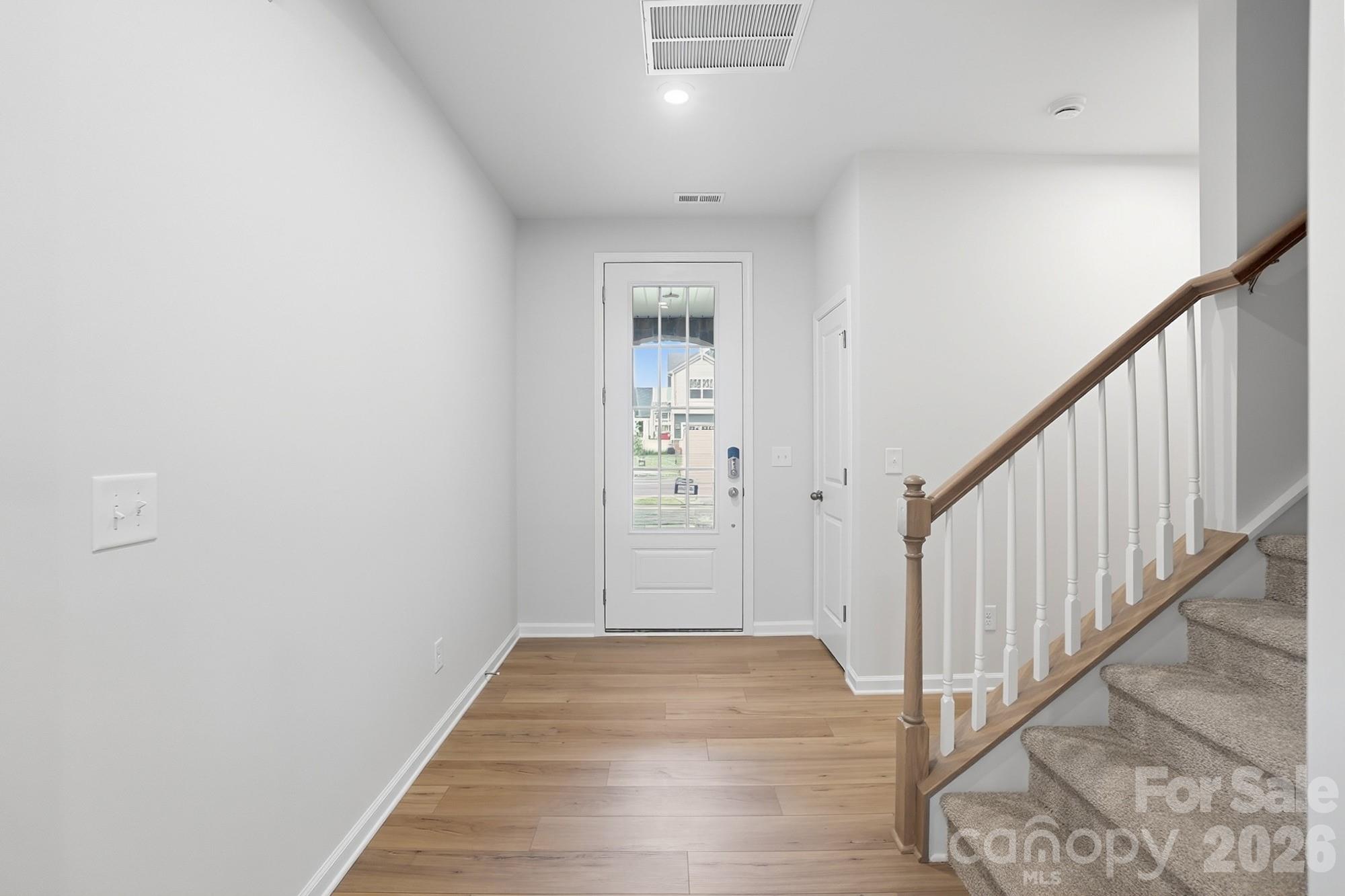 1505 Miriam Way Monroe, NC 28112 - Photo 3 of 29 a view of a hallway with wooden floor and entryway