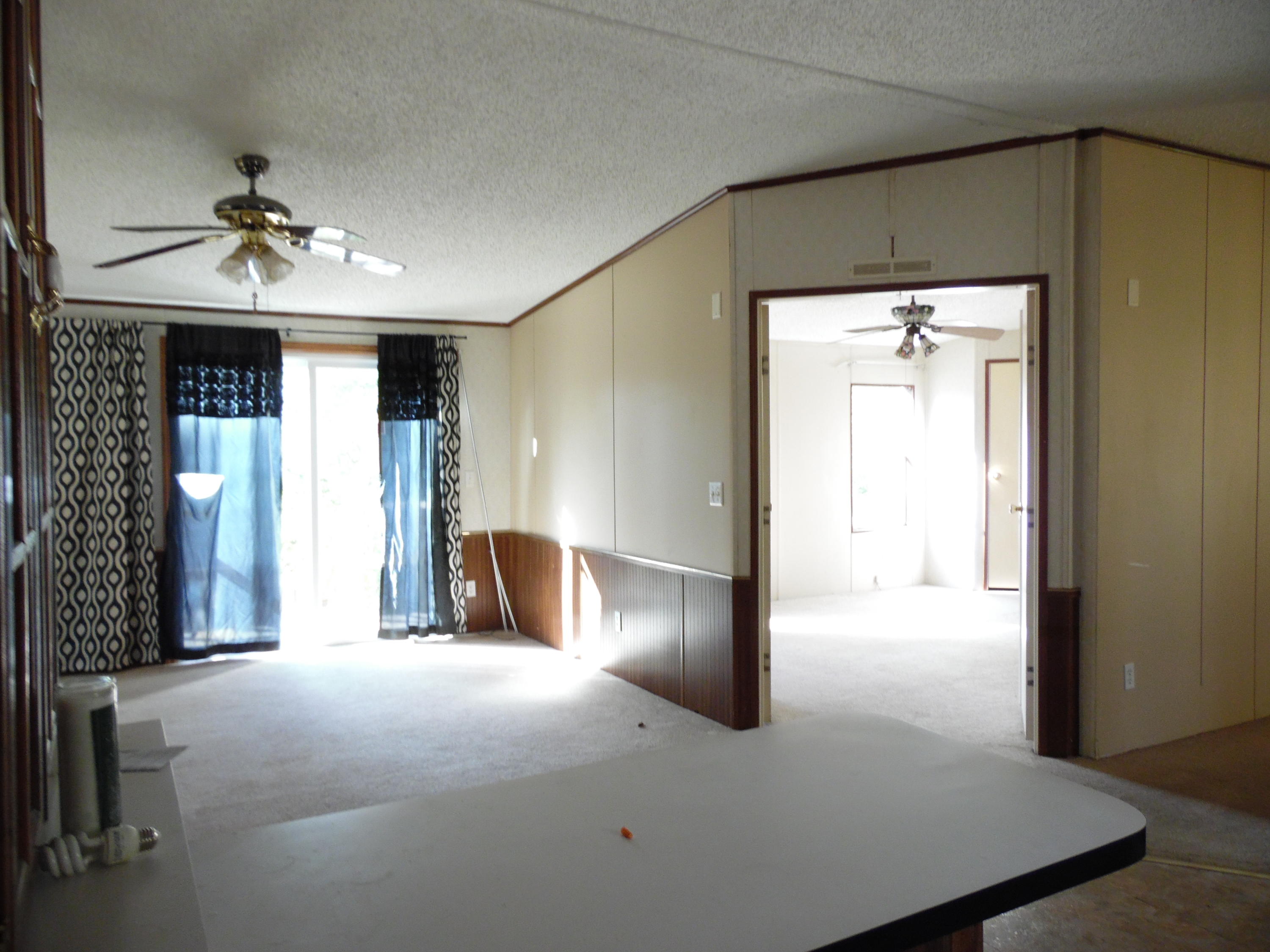 723 Squirrel Road DeFuniak Springs, FL 32433 - Photo 12 of 33 a view of a hallway with a chandelier