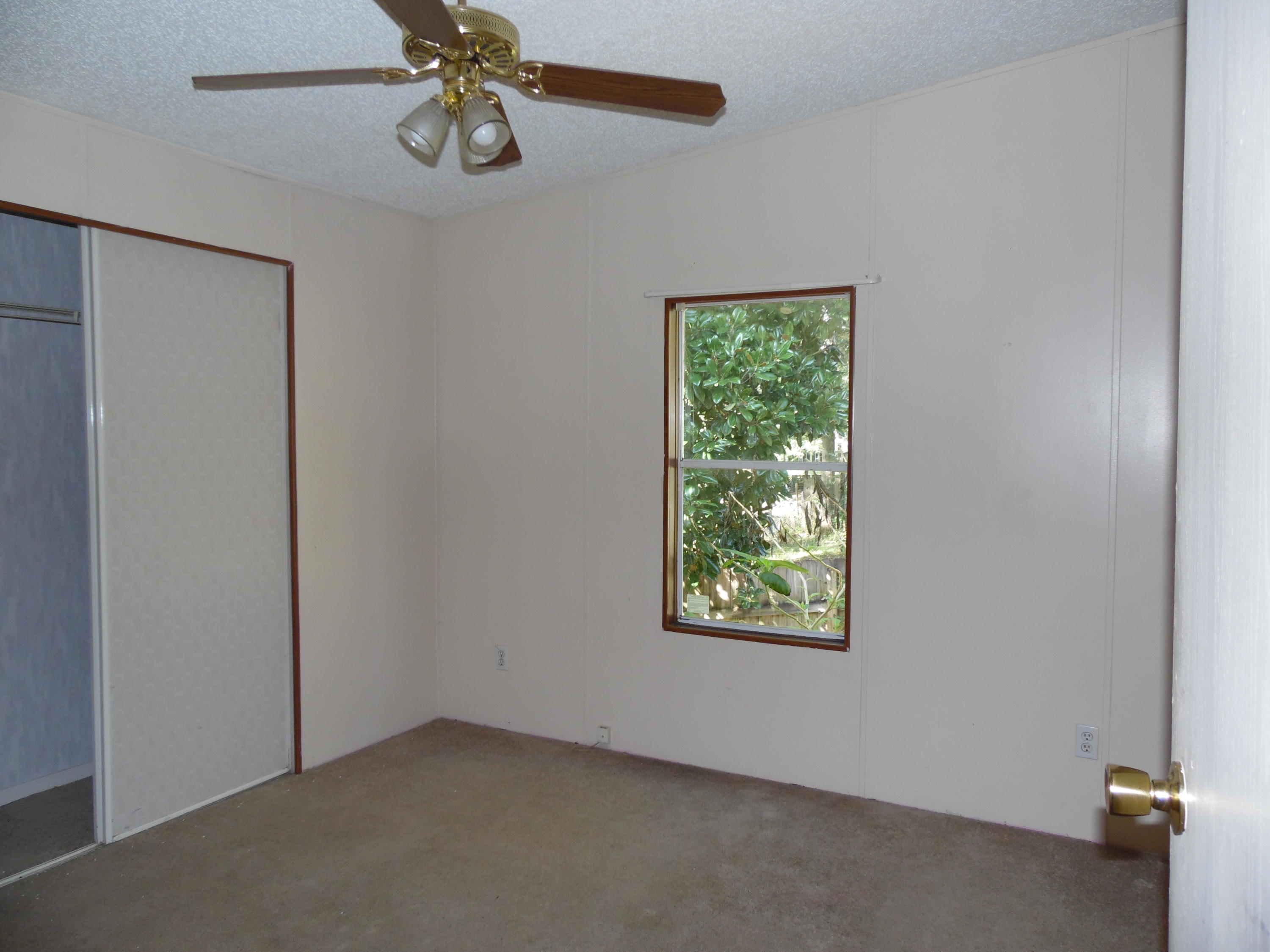 723 Squirrel Road DeFuniak Springs, FL 32433 - Photo 25 of 33 an empty room with windows