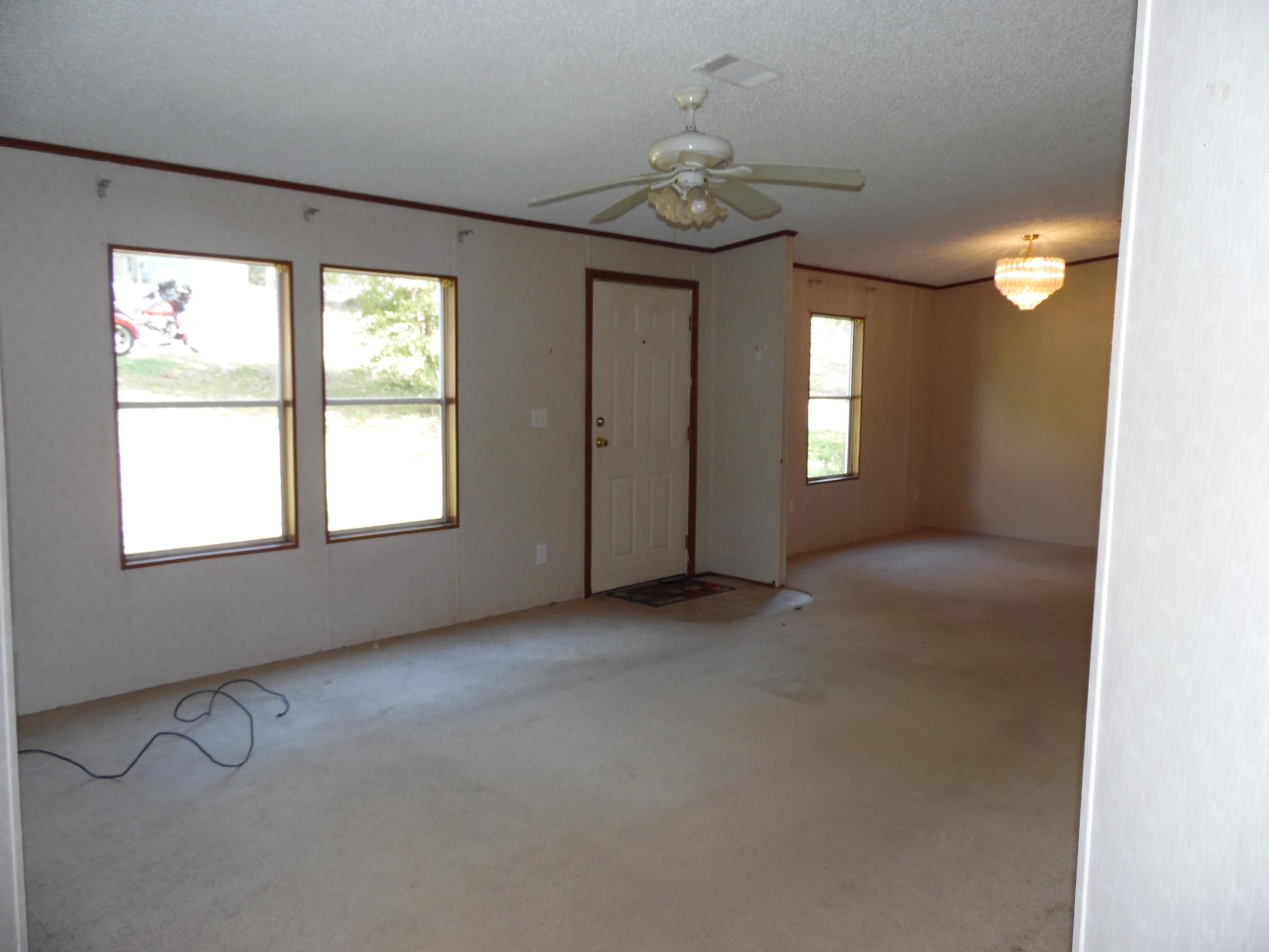 723 Squirrel Road DeFuniak Springs, FL 32433 - Photo 27 of 33 wooden floor in an empty room with a window