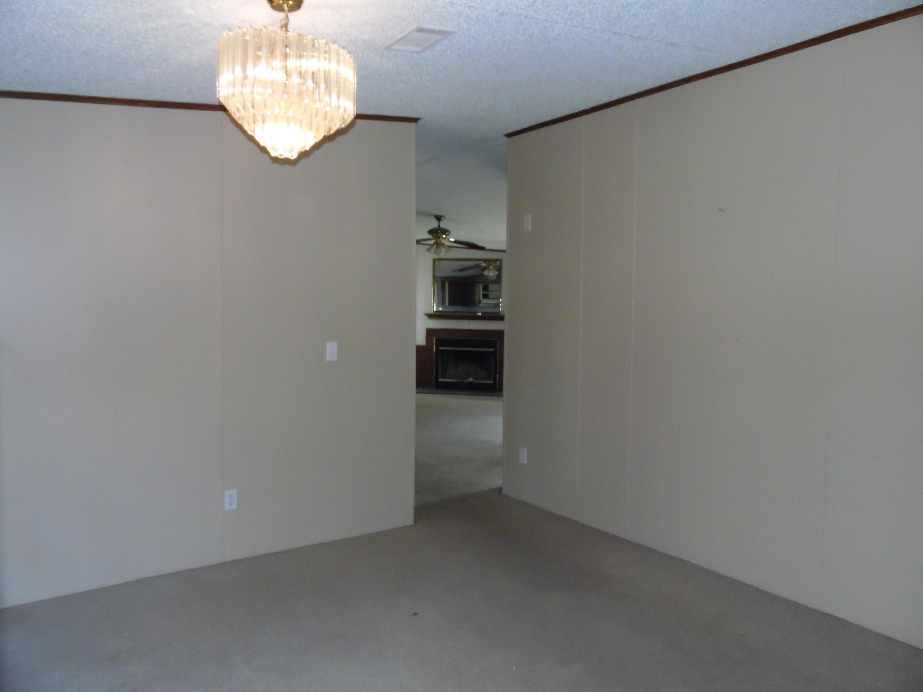 723 Squirrel Road DeFuniak Springs, FL 32433 - Photo 30 of 33 wooden floor in an empty room