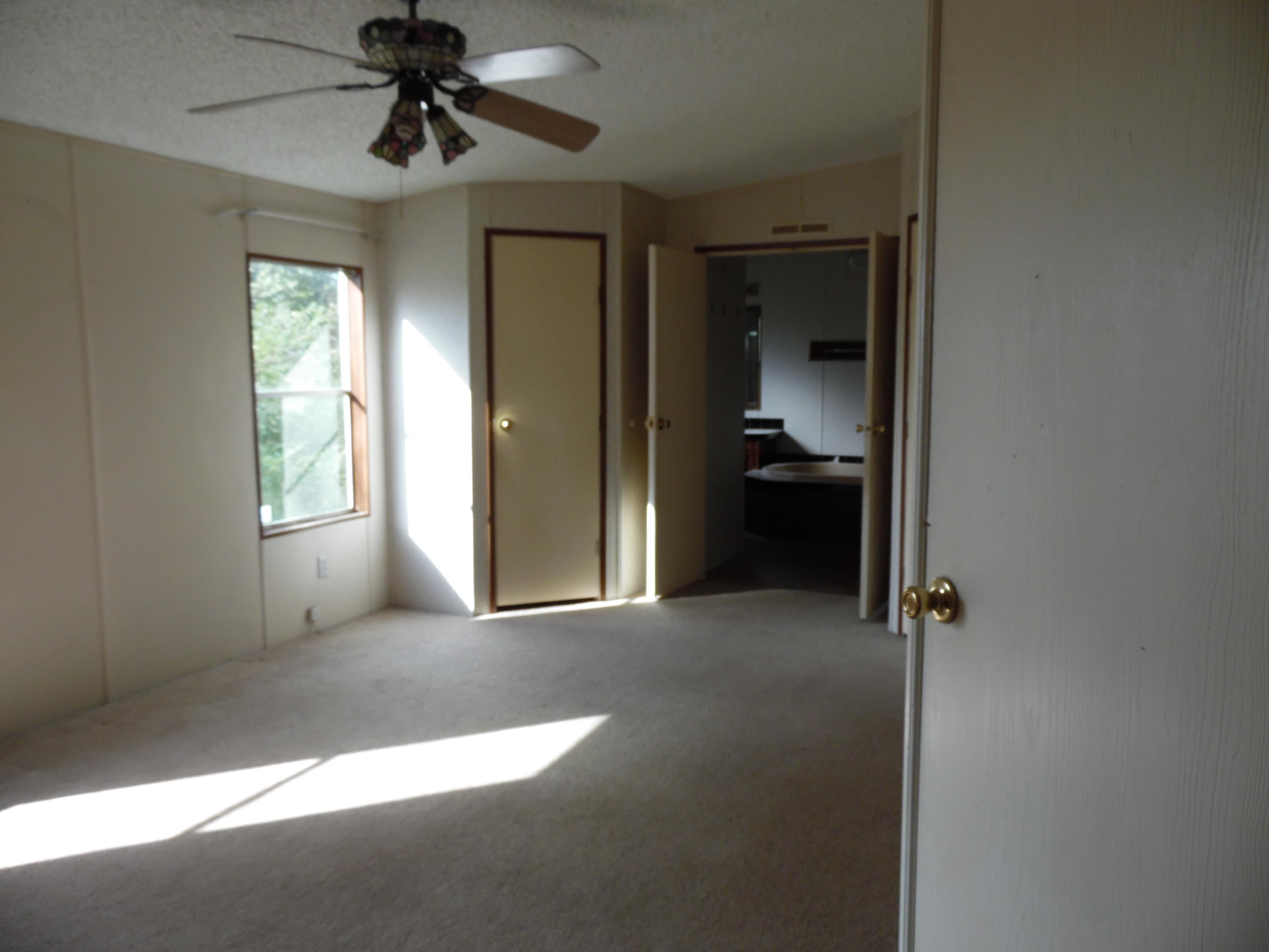 723 Squirrel Road DeFuniak Springs, FL 32433 - Photo 32 of 33 a view of empty room with windows