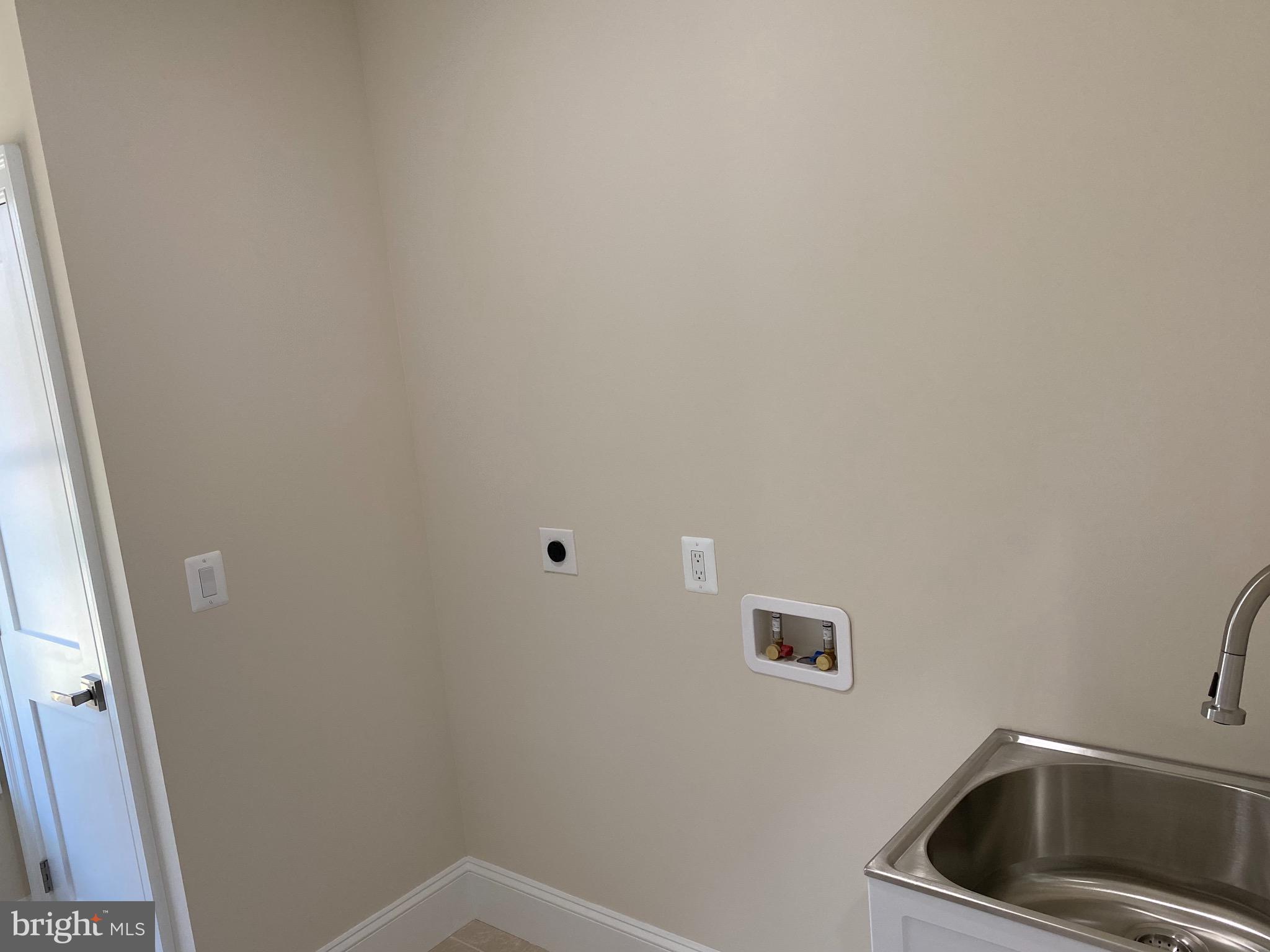 8712 Redman Street Springfield, VA 22153 - Photo 42 of 77 Laundry with linen closet & window