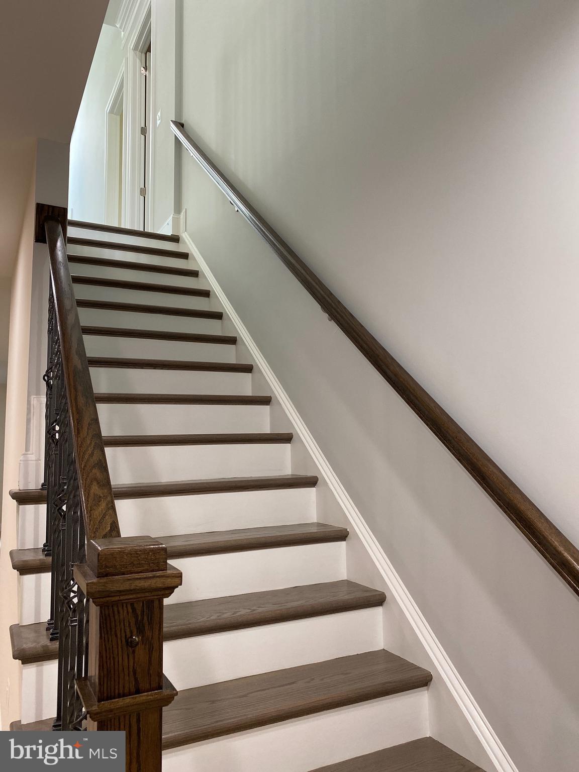 8712 Redman Street Springfield, VA 22153 - Photo 61 of 77 Staircase up to the main level.