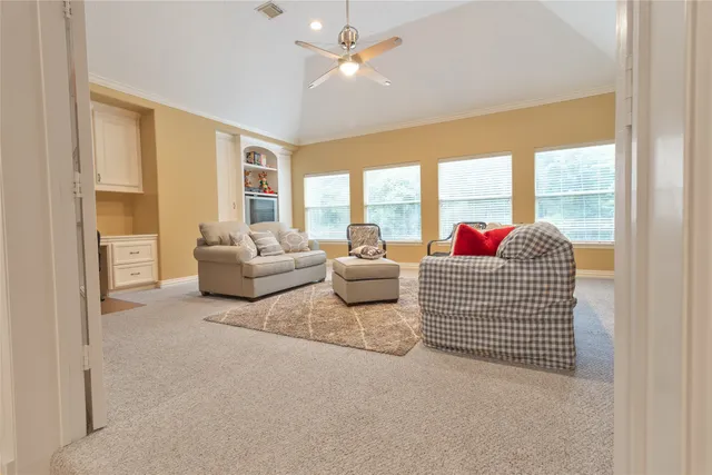 a bedroom with a bed and a table chair