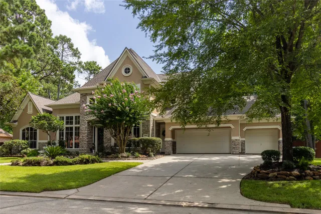 a view of a house with a yard patio and sitting area