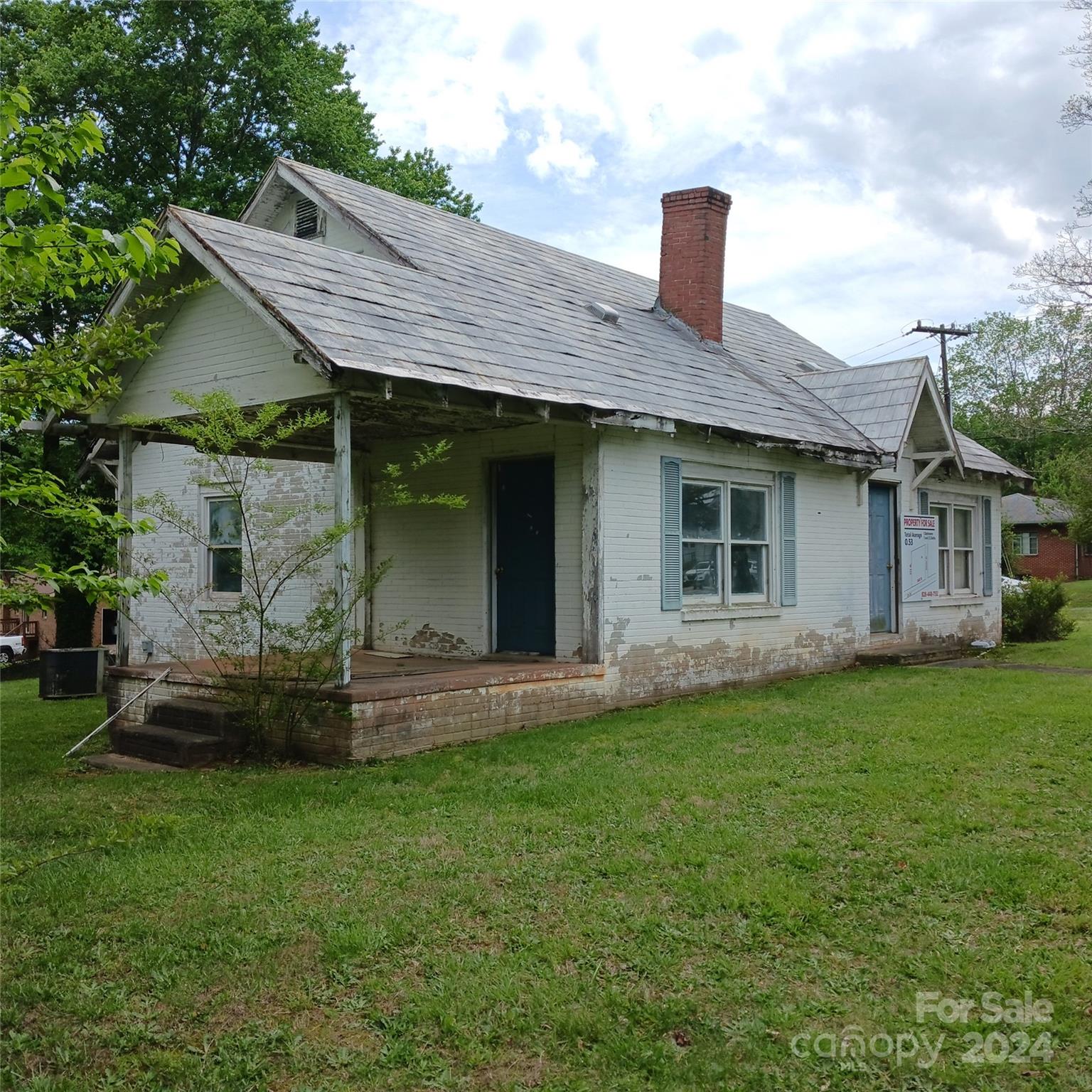 3116 Highway 70 Morganton, NC 28655 - Photo 2 of 13 a front view of a house with a garden