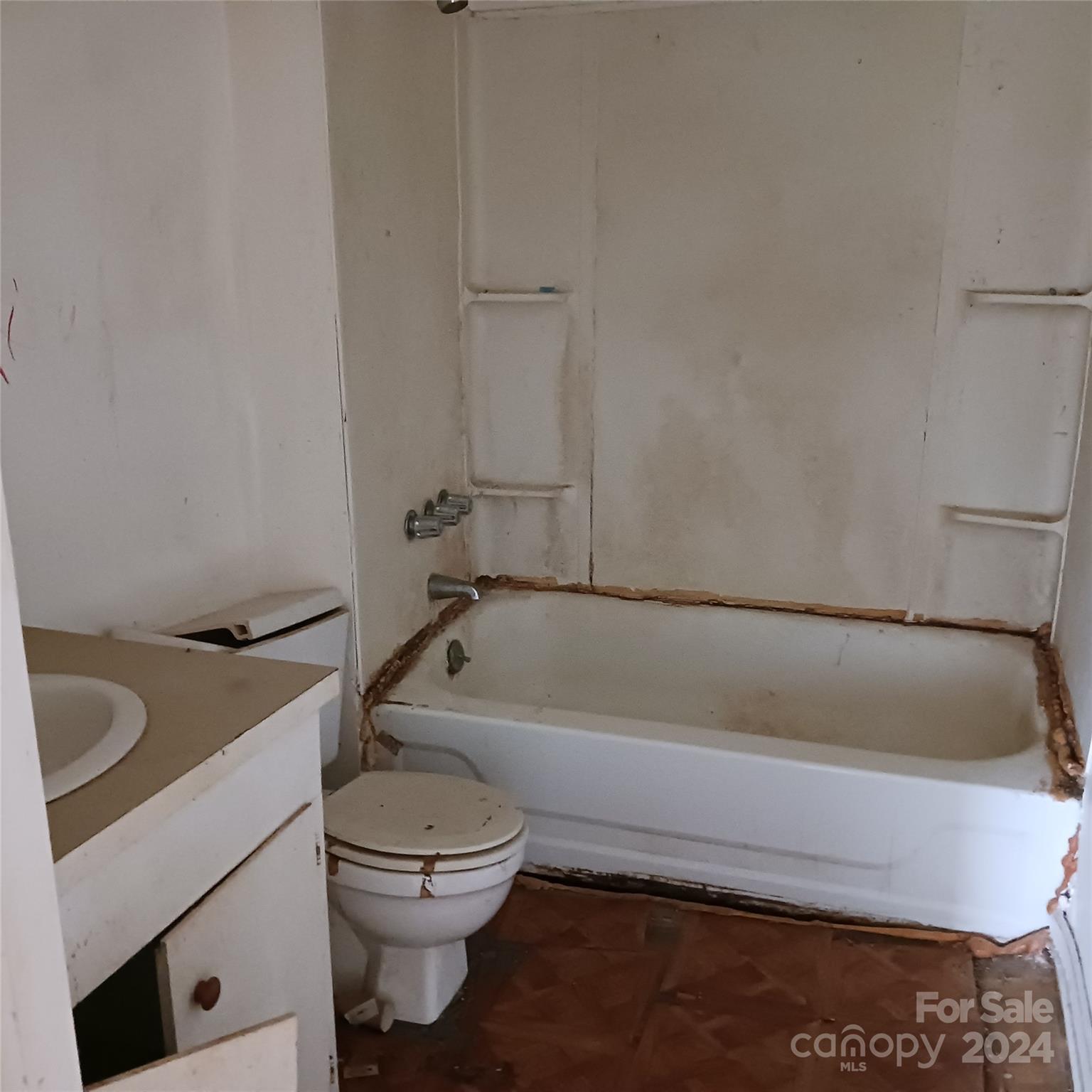 3116 Highway 70 Morganton, NC 28655 - Photo 9 of 13 a bathroom with a granite countertop toilet a sink and bathtub
