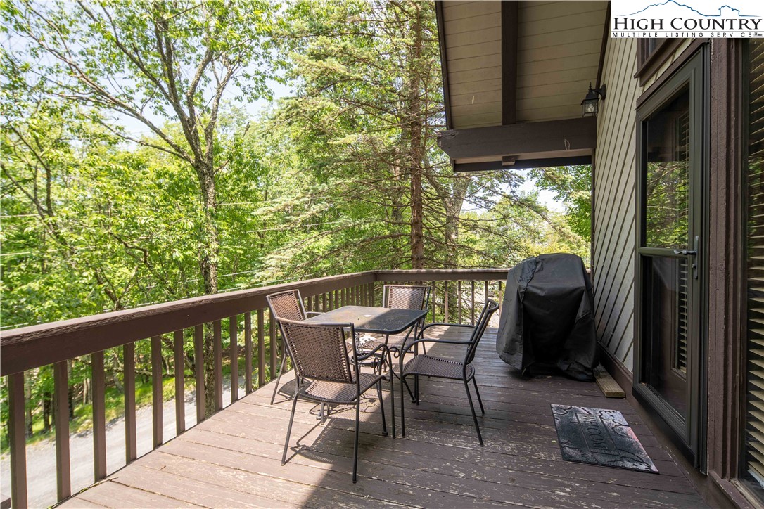 111 Pinnacle Ridge Road Beech Mountain, NC 28604 - Photo 12 of 50 a view of a two chair in the balcony