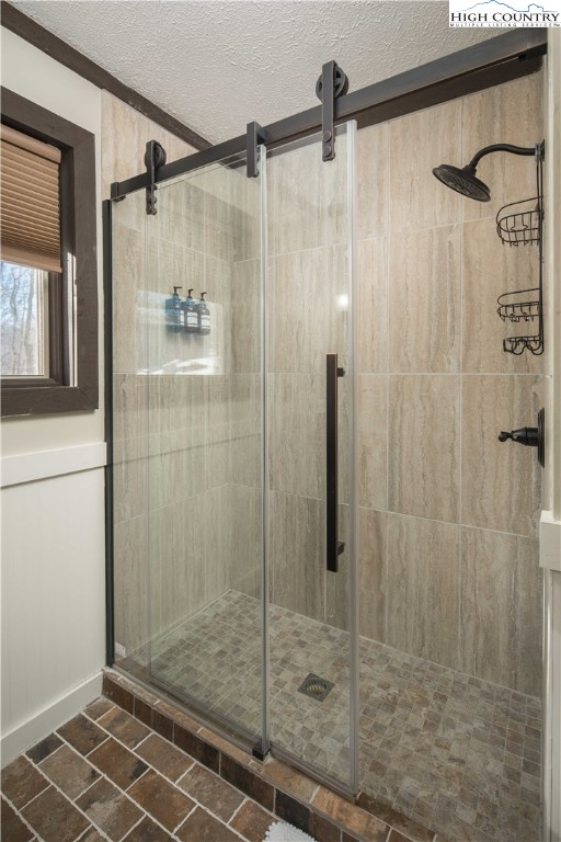 111 Pinnacle Ridge Road Beech Mountain, NC 28604 - Photo 30 of 50 a bathroom with a shower and a glass door