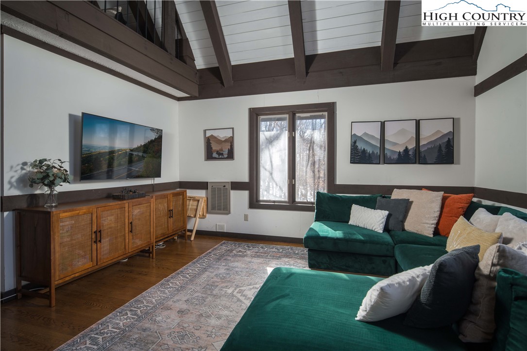 111 Pinnacle Ridge Road Beech Mountain, NC 28604 - Photo 5 of 50 a living room with furniture and a flat screen tv