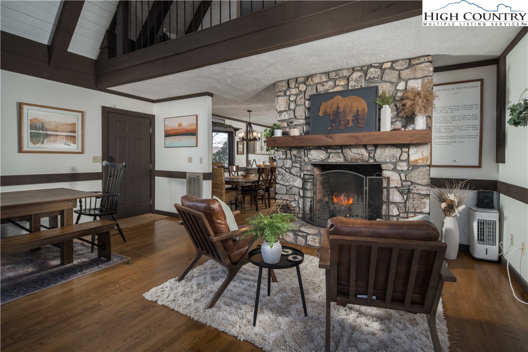 111 Pinnacle Ridge Road Beech Mountain, NC 28604 - Photo 8 of 50 a living room with furniture and a fireplace