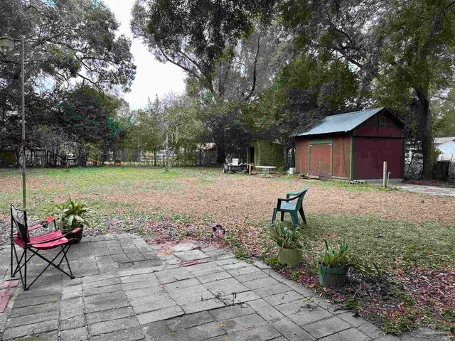 a view of a house with sitting area and potted plants