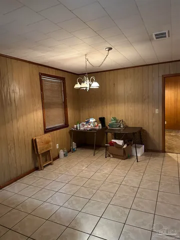 a lobby with furniture and window