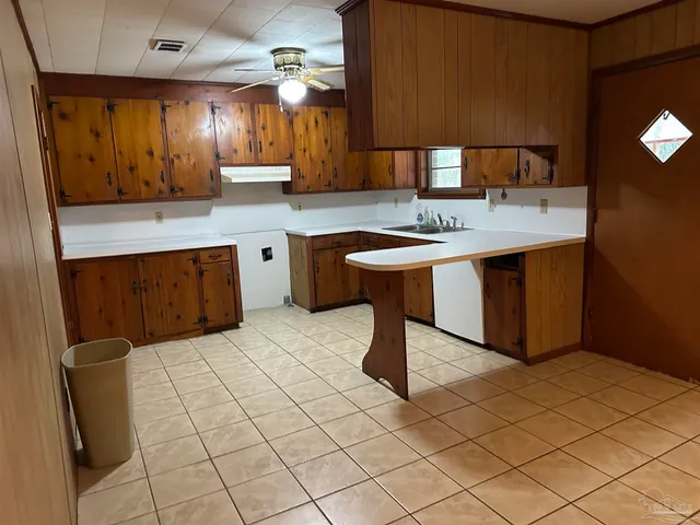 a kitchen with stainless steel appliances granite countertop a sink and a stove