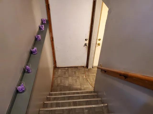 a living room with furniture a window and a flat screen tv