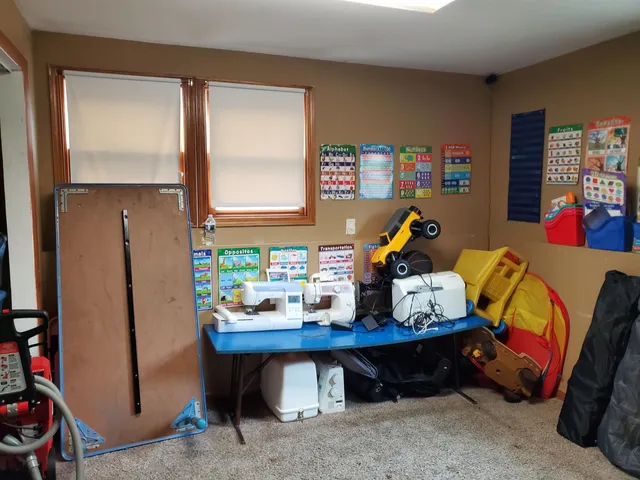 a bed room with a bed and a window