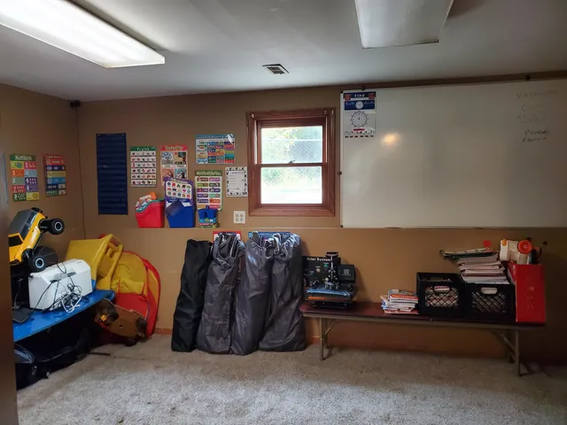 a view of a hallway with wooden shelves