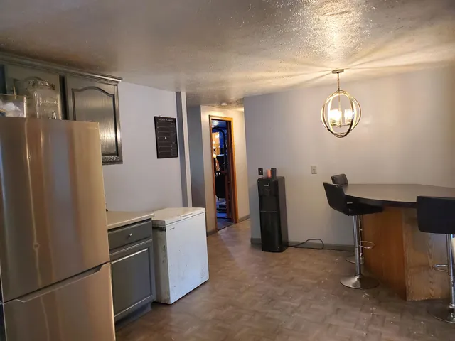 a view of a livingroom with furniture and mirror