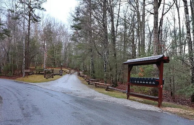 a view of a park with iron fence
