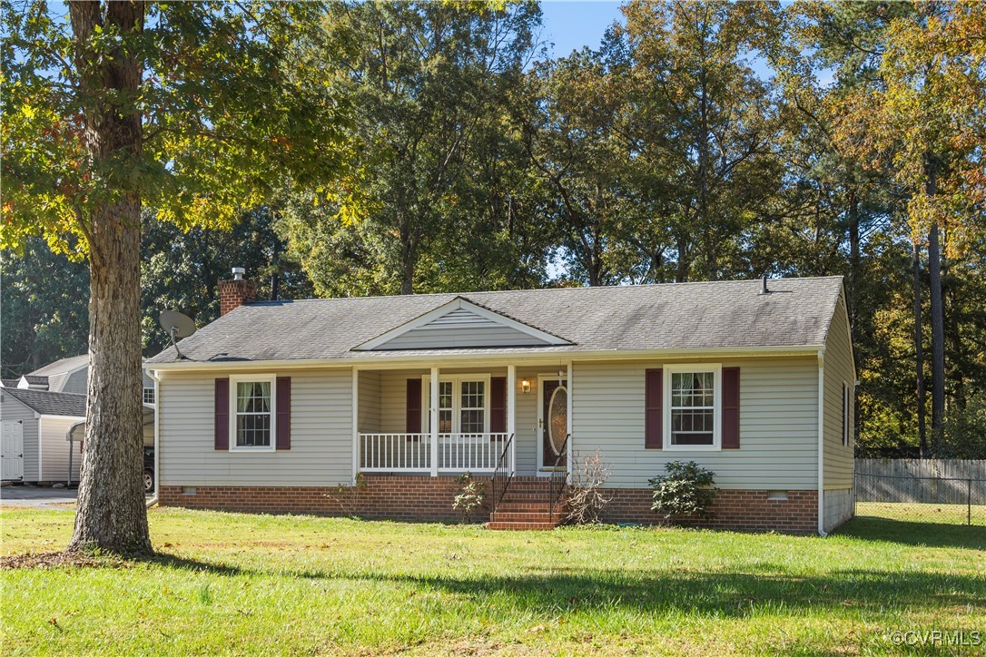 1202 Red Coach Lane Sandston, VA 23150 - Photo 1 of 16 a front view of a house with yard and green space