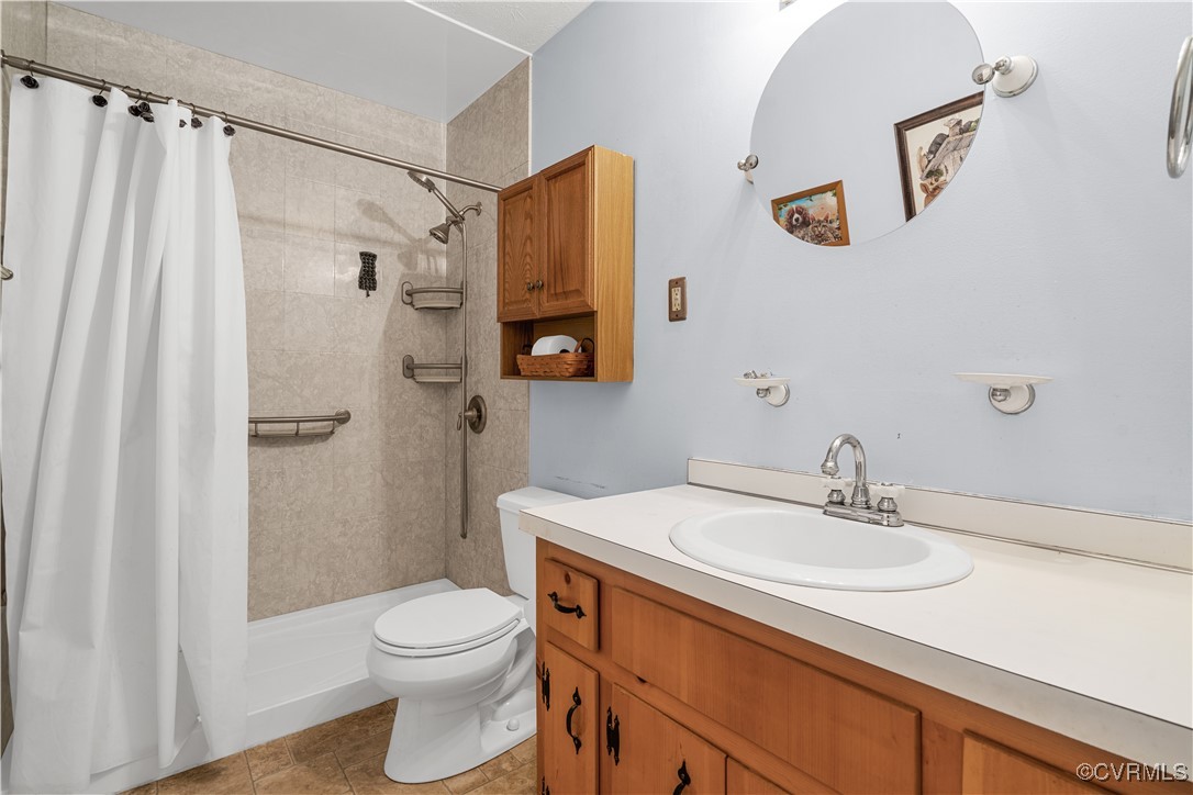 1202 Red Coach Lane Sandston, VA 23150 - Photo 11 of 16 a bathroom with a sink a toilet and shower