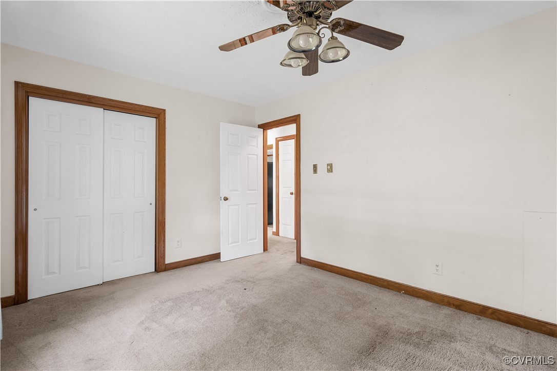 1202 Red Coach Lane Sandston, VA 23150 - Photo 12 of 16 an empty room with a chandelier fan