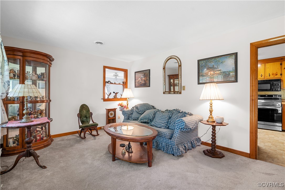 1202 Red Coach Lane Sandston, VA 23150 - Photo 14 of 16 a living room with furniture a piano and a window