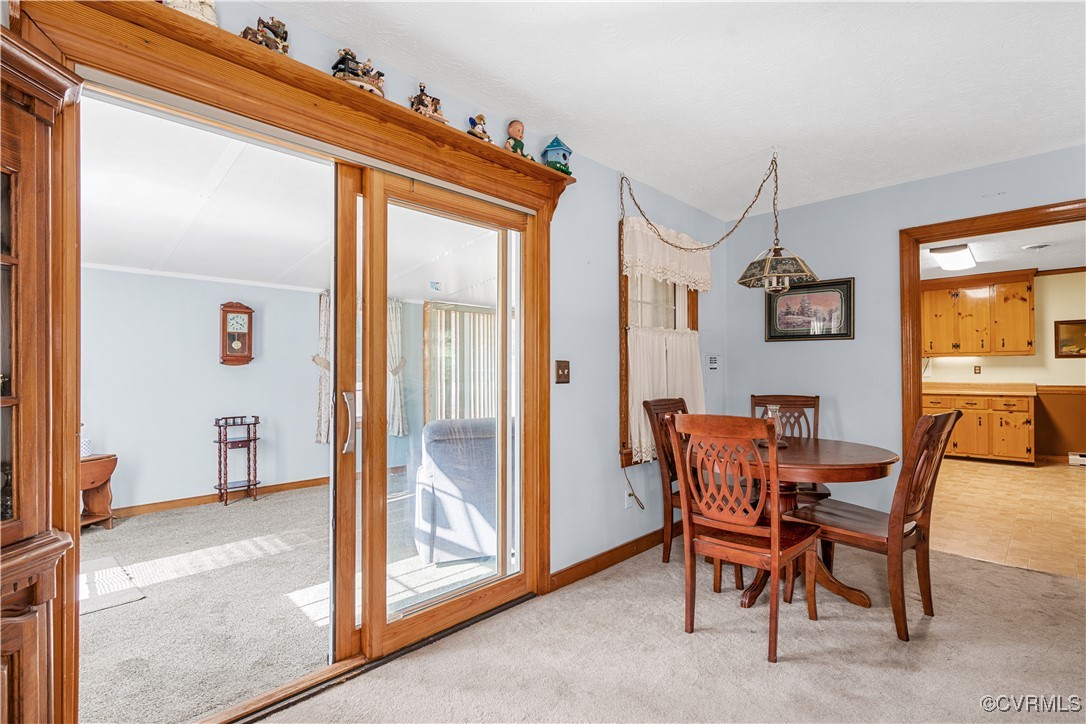 1202 Red Coach Lane Sandston, VA 23150 - Photo 6 of 16 a view of a dining room with furniture and a chandelier