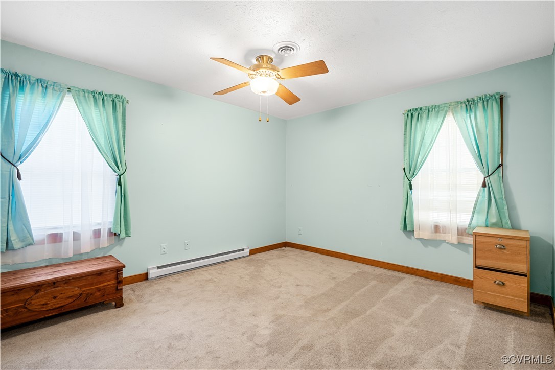 1202 Red Coach Lane Sandston, VA 23150 - Photo 9 of 16 an empty room with windows and fan