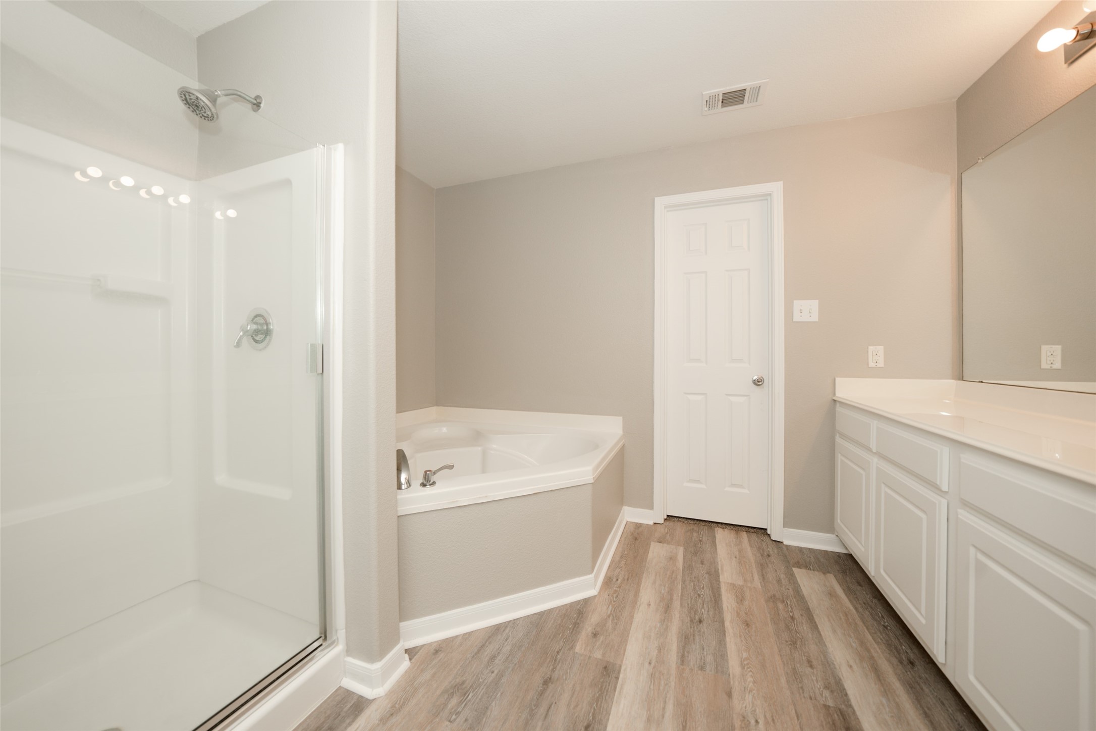 28894 Llano River Loop Spring, TX 77386 - Photo 15 of 33 a bathroom with a bathtub a sink and a shower