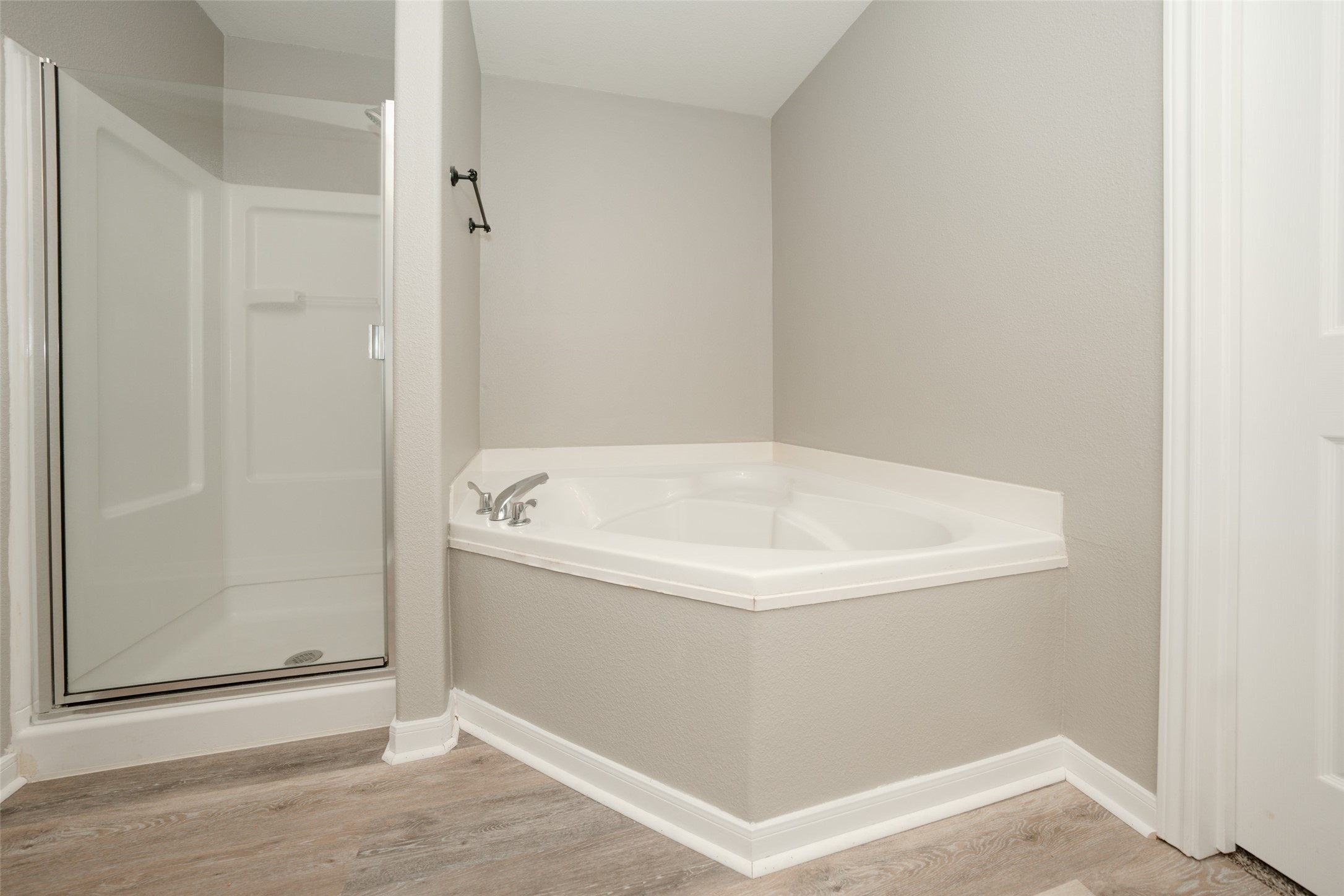 28894 Llano River Loop Spring, TX 77386 - Photo 17 of 33 a white bath tub sitting in a bathroom