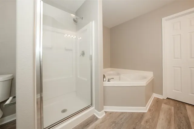 a bathroom with a bathtub and a shower