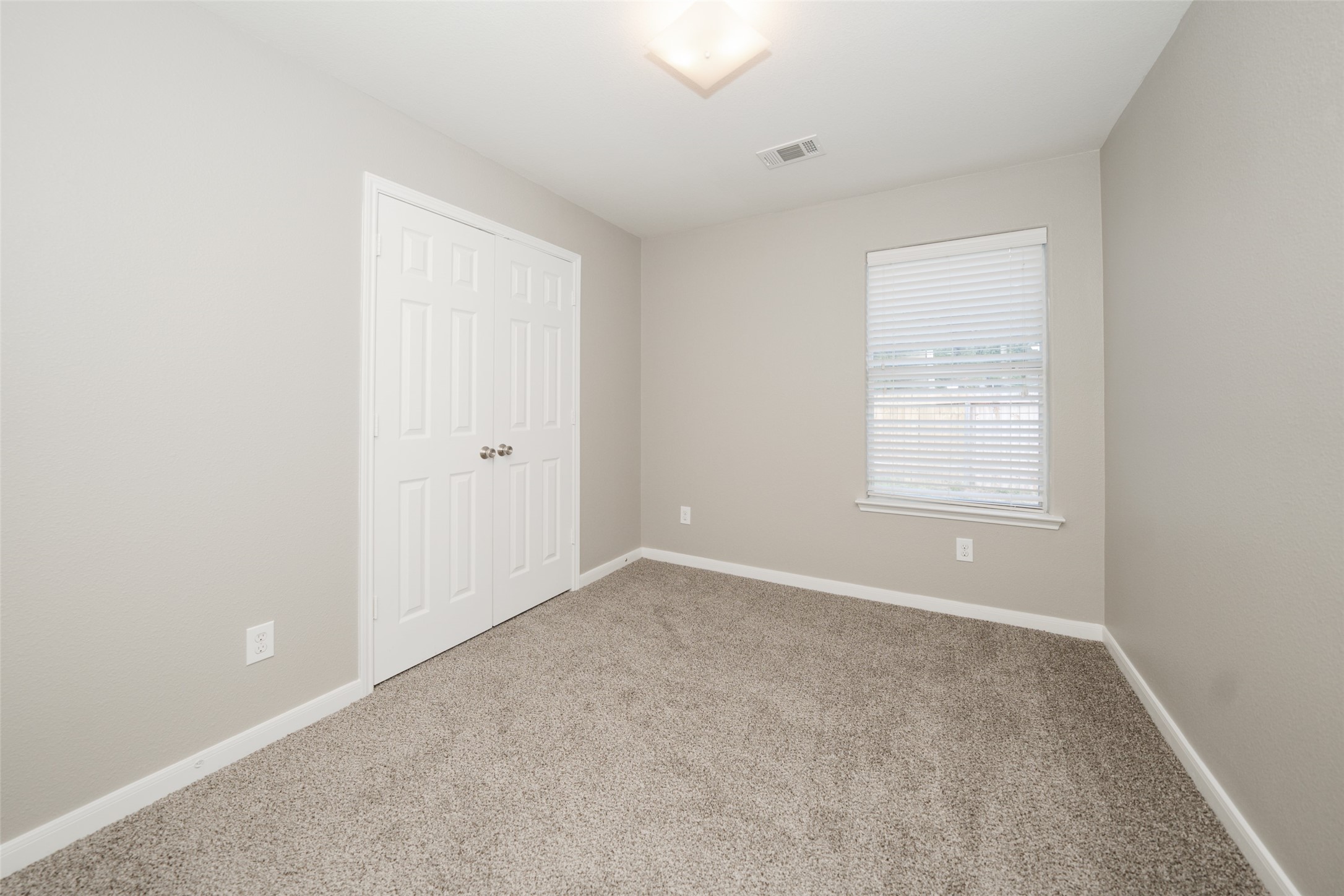 28894 Llano River Loop Spring, TX 77386 - Photo 19 of 33 an empty room with windows