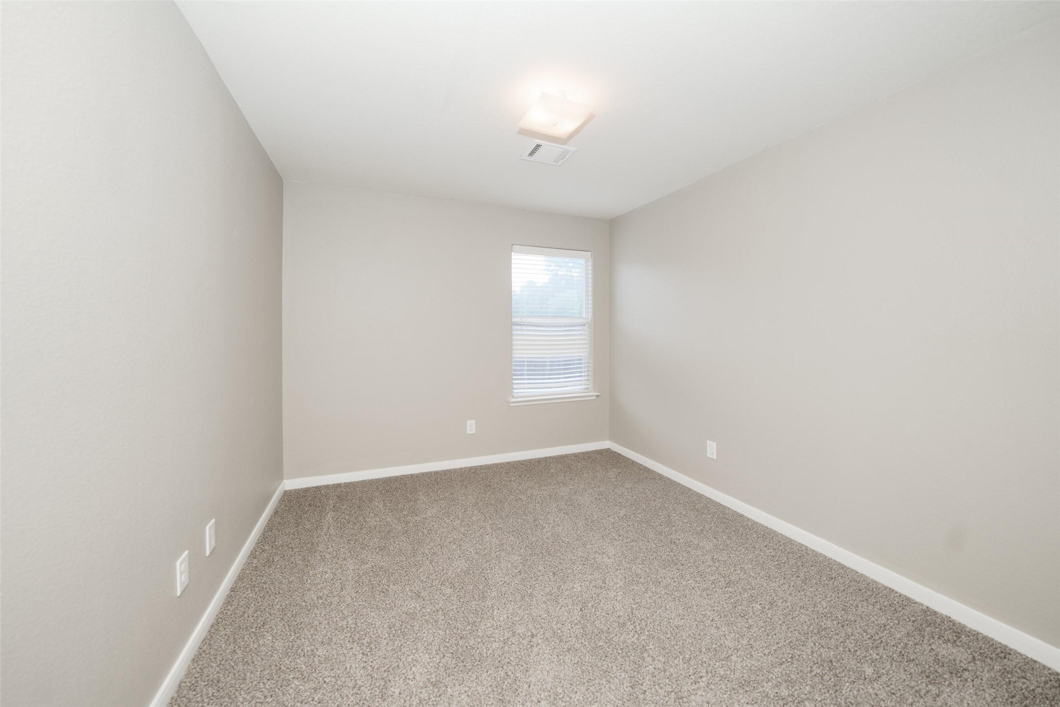 28894 Llano River Loop Spring, TX 77386 - Photo 20 of 33 a view of an empty room with a window