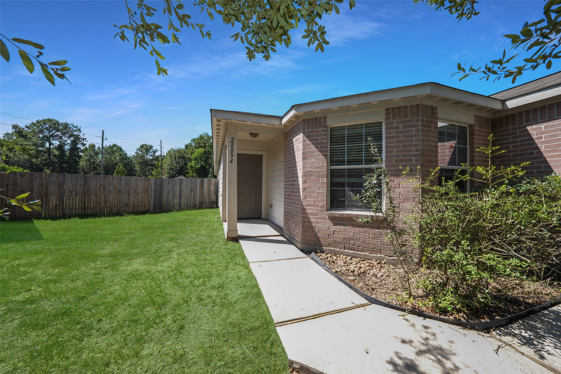 28894 Llano River Loop Spring, TX 77386 - Photo 2 of 33 front view of a house with a yard