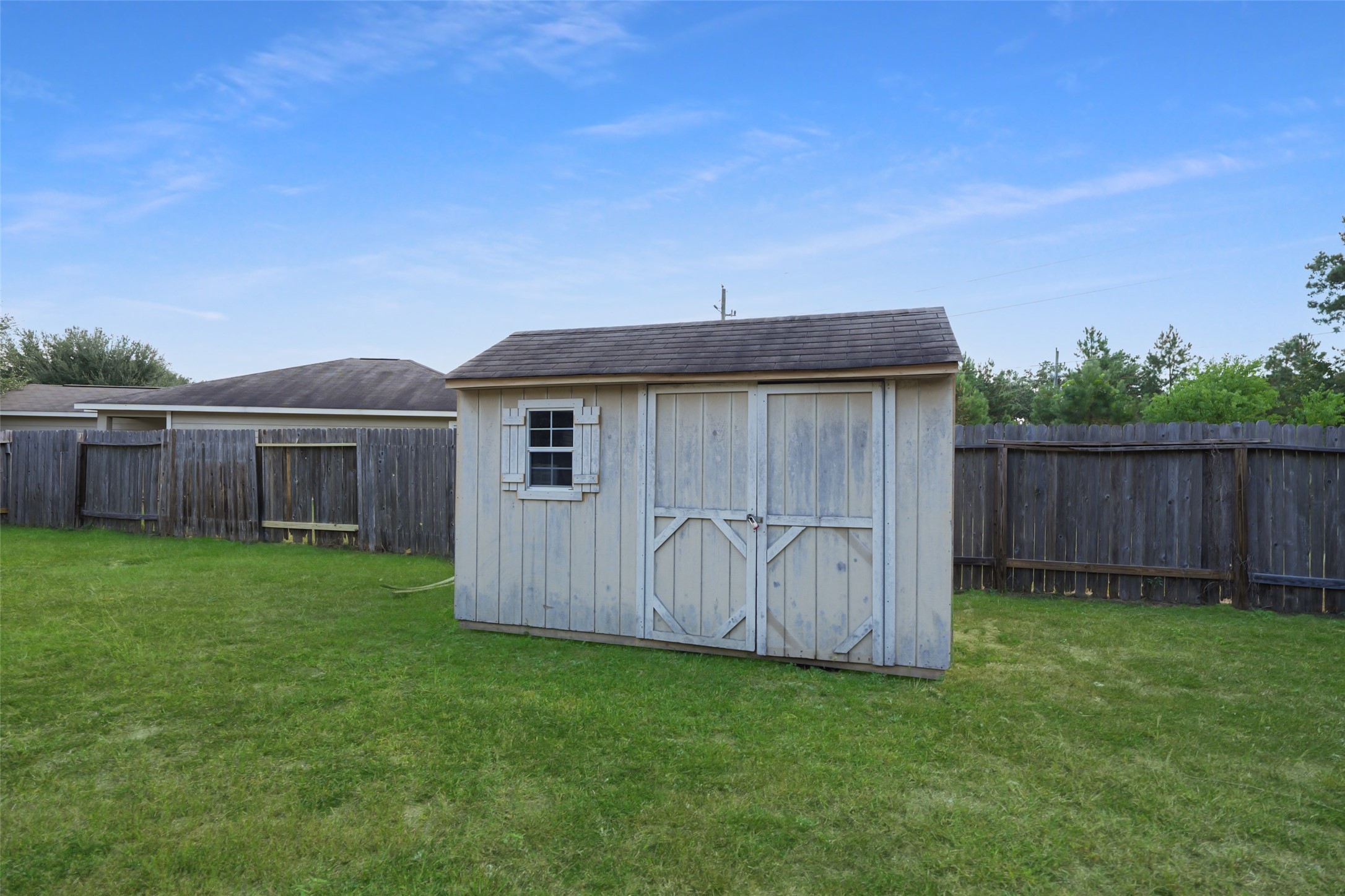 28894 Llano River Loop Spring, TX 77386 - Photo 30 of 33 a view of a backyard with wooden fence