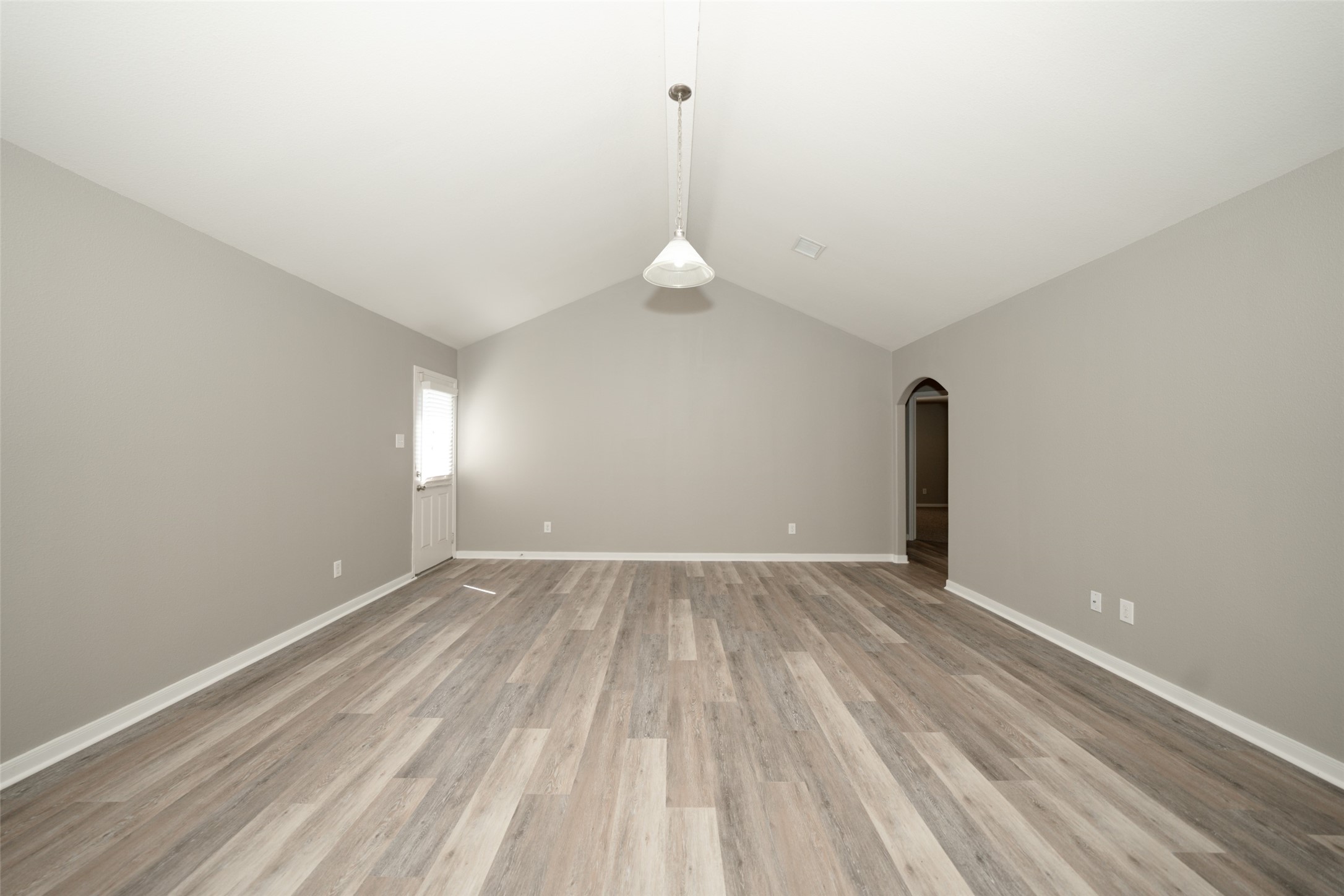 28894 Llano River Loop Spring, TX 77386 - Photo 4 of 33 a view of empty room with wooden floor and window