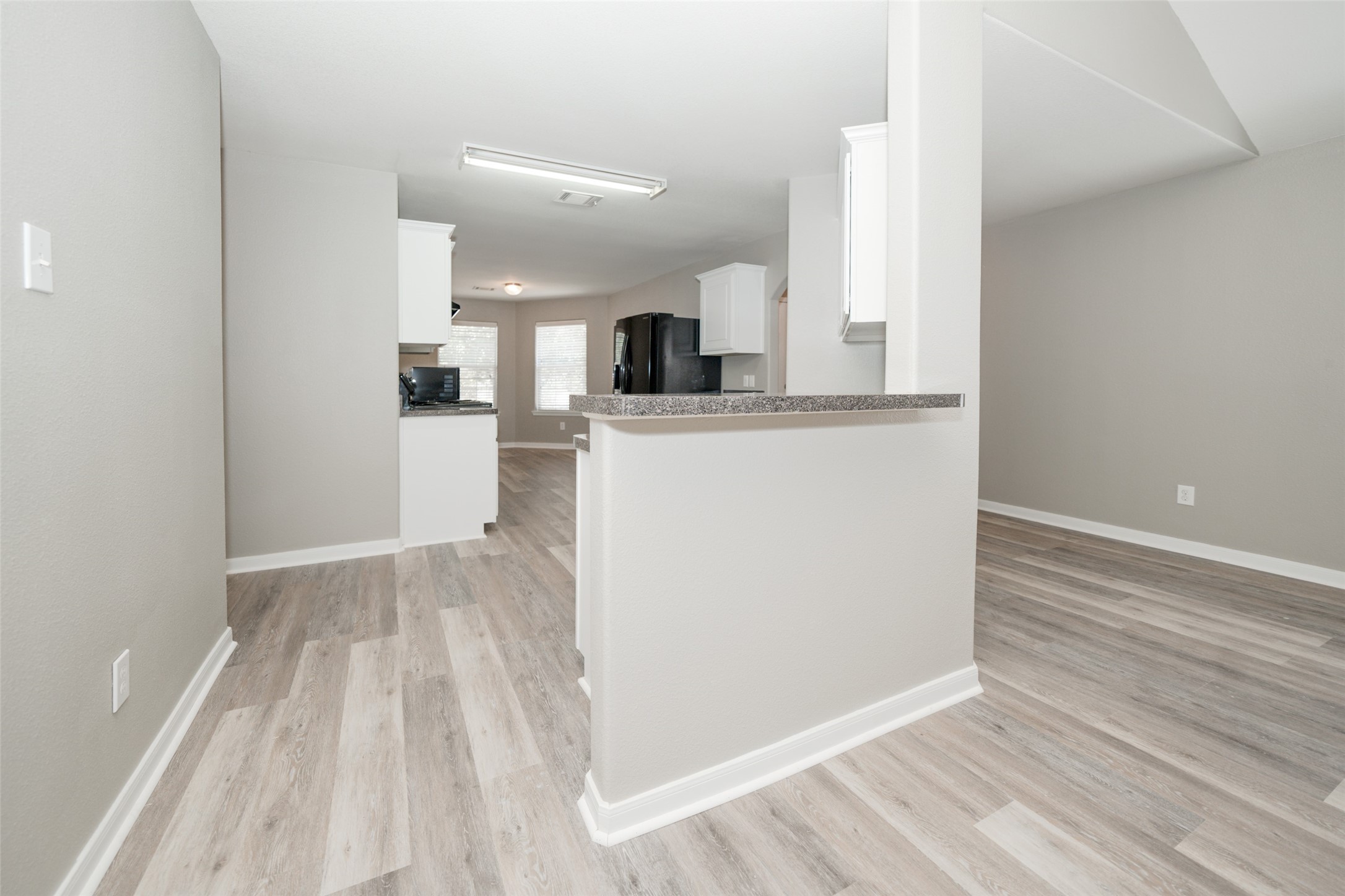 28894 Llano River Loop Spring, TX 77386 - Photo 5 of 33 a view of kitchen and wooden floor