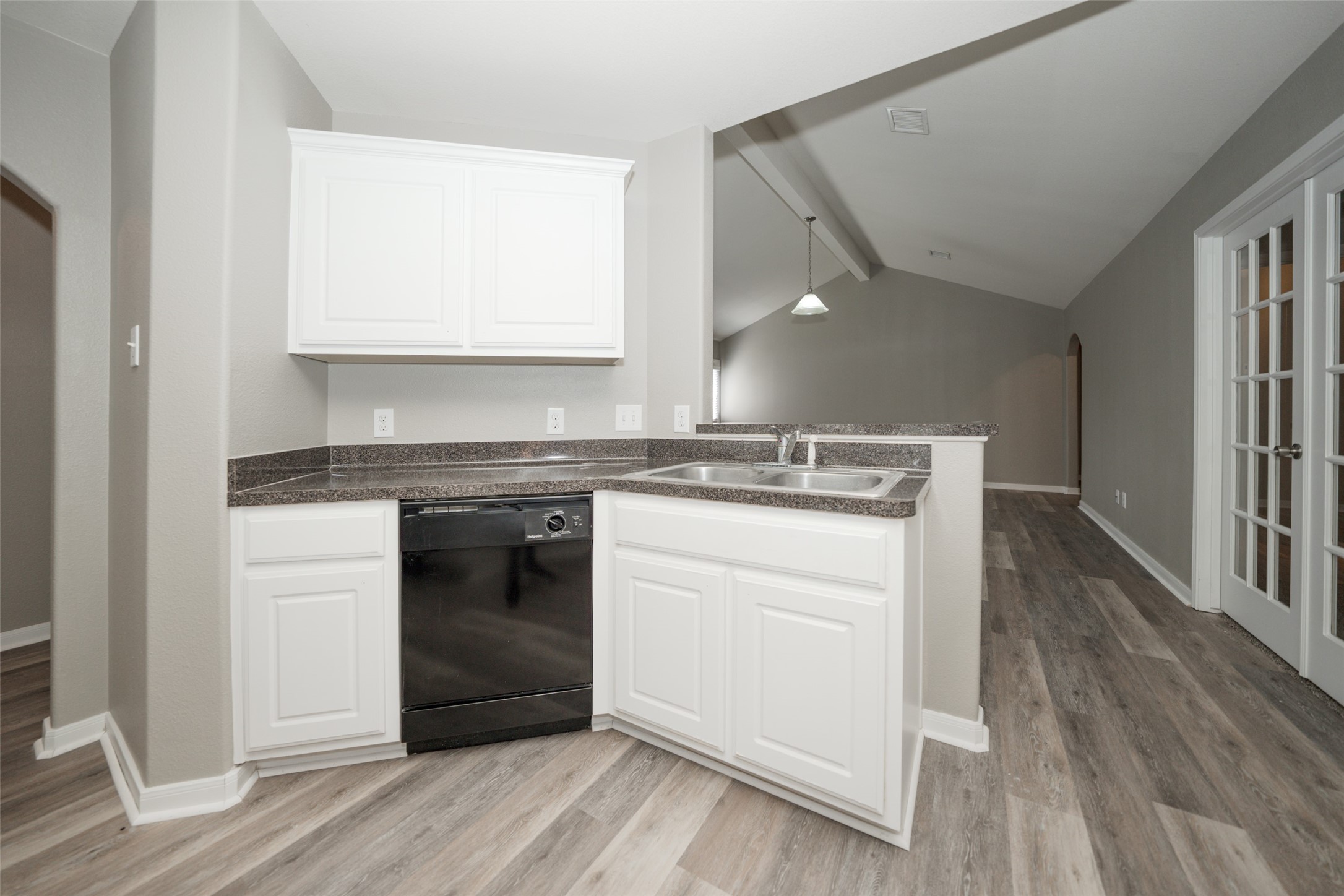 28894 Llano River Loop Spring, TX 77386 - Photo 6 of 33 a kitchen with a stove cabinets and wooden floor